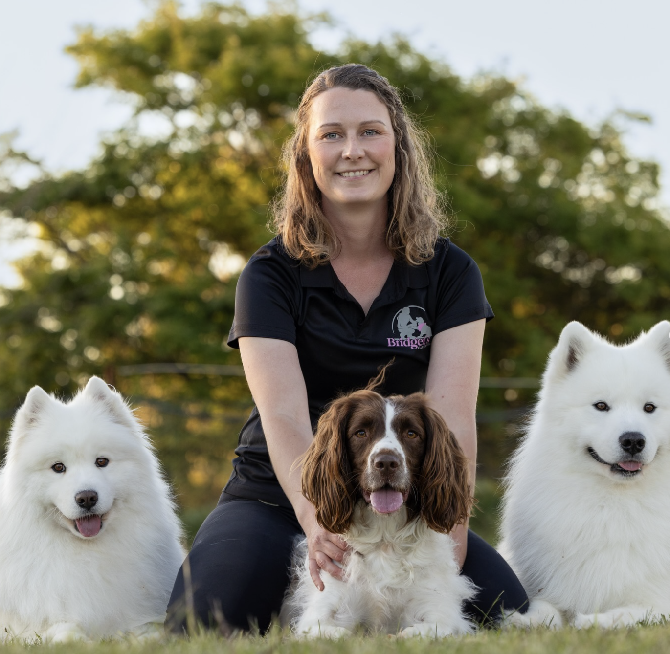 Bridget with three dogs outdoors